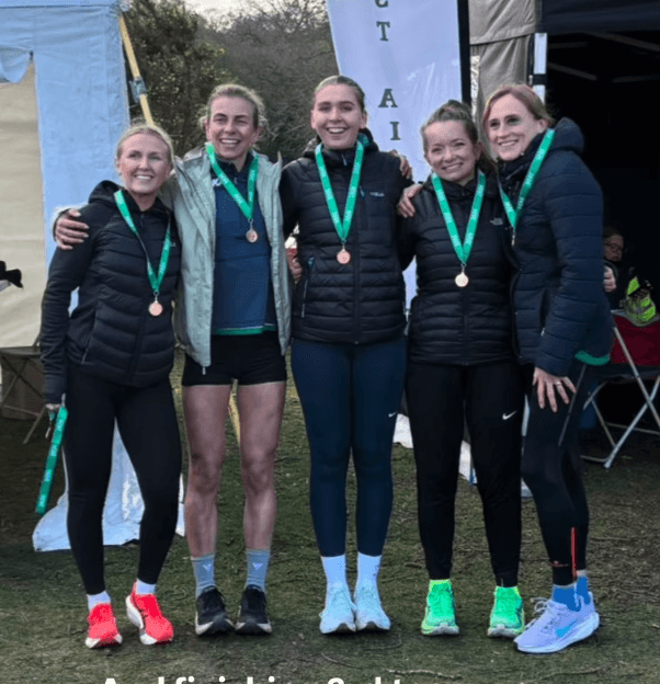 Tipton Harriers Endurance women's team celebrate their bronze medal at the 2026 Midland Counties Cross Country Relays